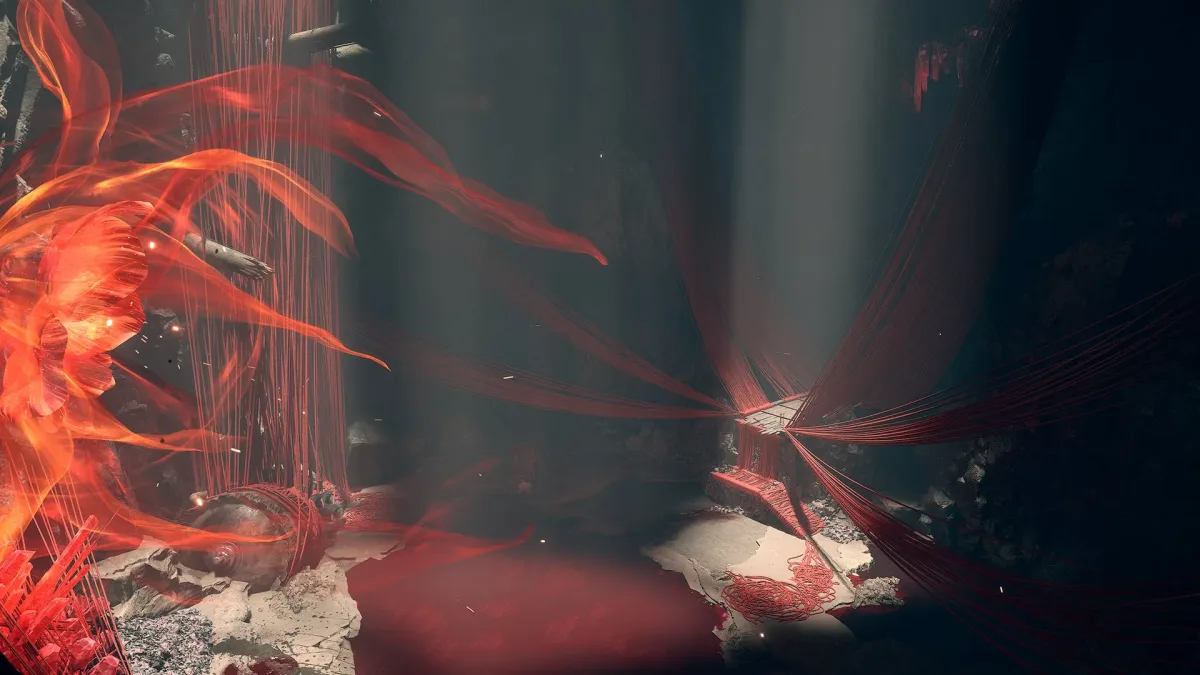Phantom Blade Zero’da kırmızı ipliklerle çevrili karanlık taş mekan